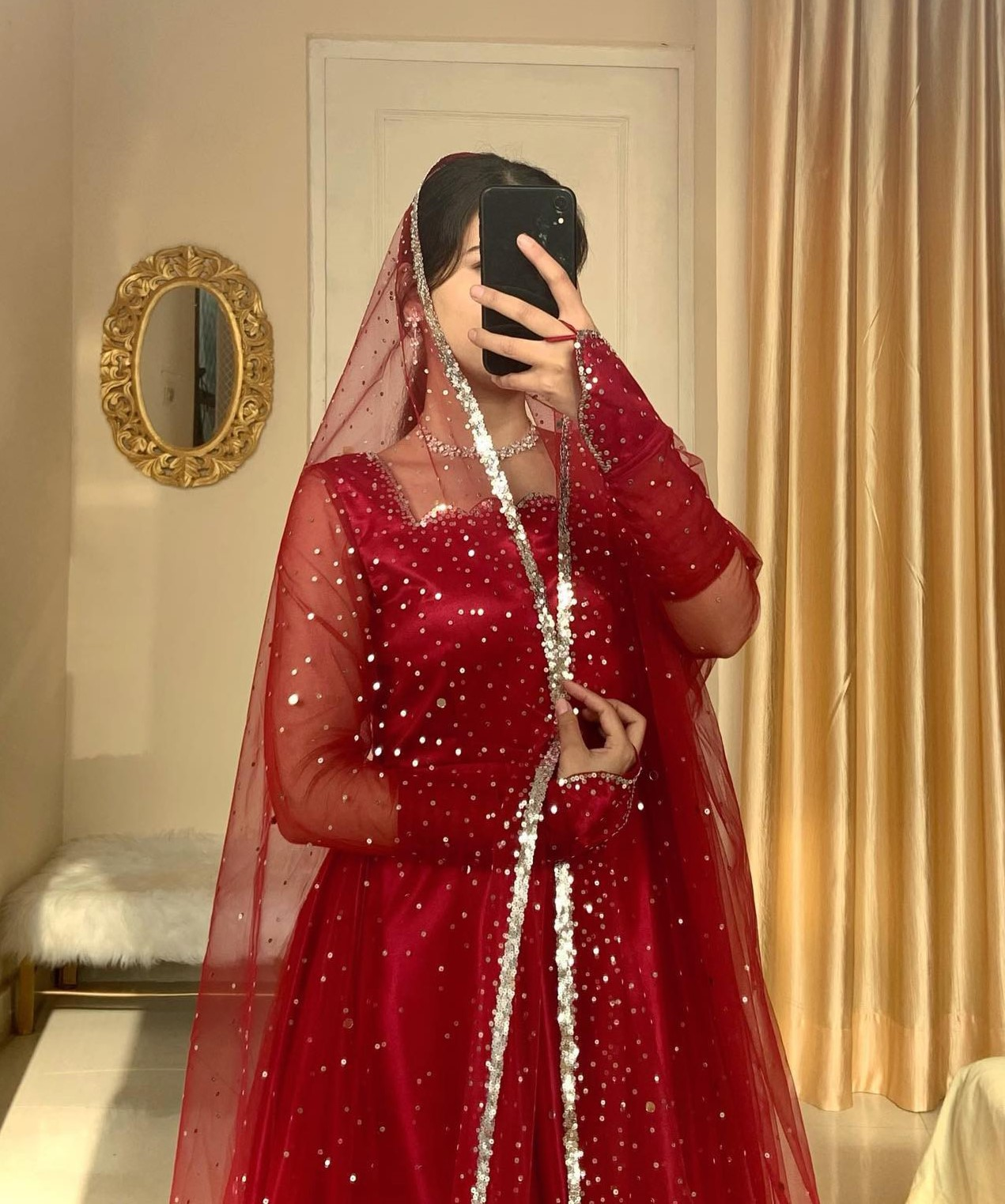 Girl wearing a Red Moon Lehenga 